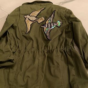 Green jacket with patches